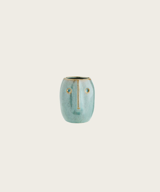 Pot de fleur visage vert clair